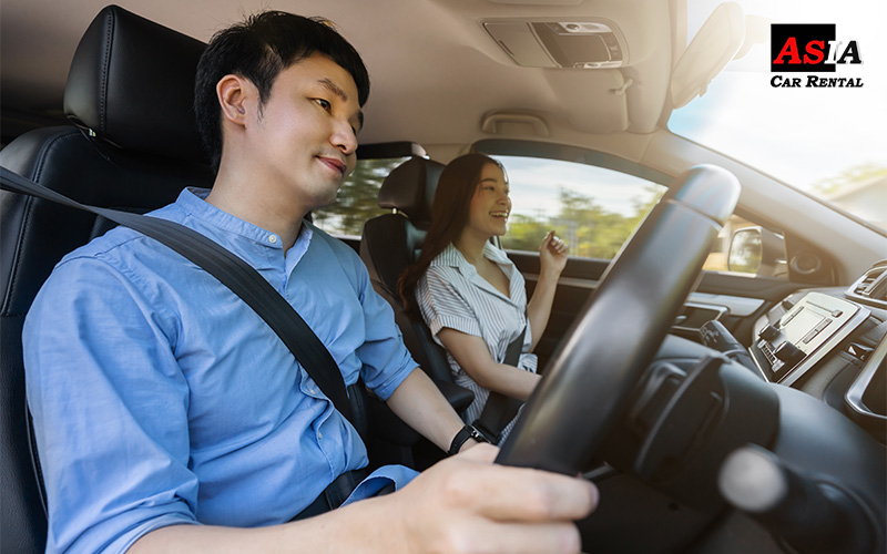 couple in a car doing a road trip