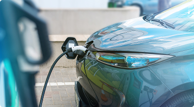 plugged-charger-into-electric-car-charge-station