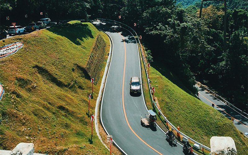 cars-driving-down-a-windy-road