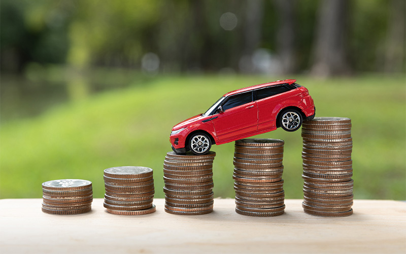 toy-car-on-stack-of-coins